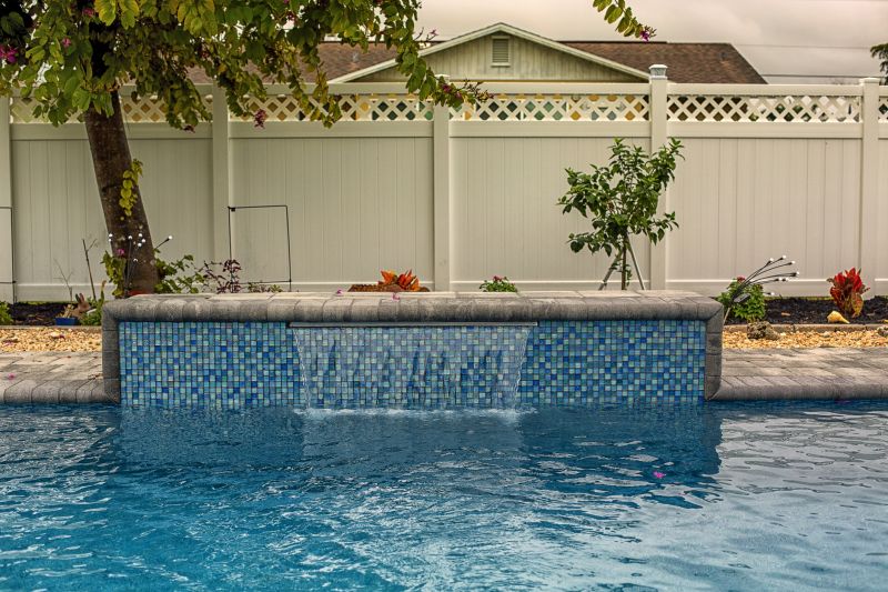 Fenced Pool with Lush Landscaping